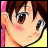 Pixelated anime-style character face with brown hair and large eyes, next to stylized text on black background.