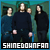 Four pixelated figures in dark clothing stand against a teal-green background with white text at the bottom reading SHINEDOWNFAN.