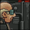 Pixel art of a character with light brown hair and glasses holding a green cube, standing before dark machinery with red accents.