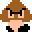 Pixelated character with brown hair, black glasses, peach skin, and black clothing against gray background.