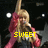 A pixelated character with blonde hair and a red bow, wearing pink sleeves, appears in two against a dark background with white circular lights