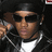 A pixelated image of a person wearing sunglasses and a black jacket over a white shirt, with red text reading "Boy Boy" and a single red "A" on black backgrounds.