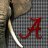A static pixelated image shows a red anchor symbol on a checkered background with a white curved line and dark vertical element.