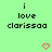 Green background with black pixelated text reading "i love clarissa" and two pink heart icons below.