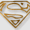 Animated sequence of Superman S-shield icons in gold and white, showing variations in outline thickness and partial visibility across frames.