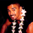 Pixelated static image of a person with orange-toned skin holding a white flower-like object against black background, rendered in low-resolution 256x256 pixels.