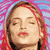 Static pixelated image of a person's face with closed eyes, brown hair with red highlights, and pink/red background elements.