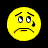 Yellow pixelated emoji with downturned mouth, furrowed brows, and single tear on black background; adjacent blue display text fragments