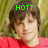 Pixelated image of a person with brown hair wearing a red shirt, green text reading HOTT above the head against a blurred background.