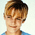 A pixelated contact sheet showing two frames of an animated buddy icon featuring a person on the left and green text on a dark background on the right.