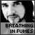 Pixelated grayscale image of a person's face with a neutral expression, overlaid with bold text reading "BREATHING IN FUMES" on a gray banner.