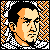 Pixelated static icon featuring a stylized human face with orange and beige tones against a black-and-white checkered border.