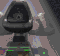 Animated sequence showing a dark helmeted figure with green accents rotating through three positions against a muted background.