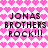 Pixelated text 'JONAS BROTHERS ROCK!!!' repeated twice on a pink heart-patterned background with no visible animation changes.