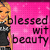 Pixelated image of a person with blonde hair wearing dark clothing against a pink background with text reading 'blessed wit beauty' in black letters.