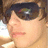 Pixelated image of a person with brown hair and dark sunglasses on the left, next to a dark blue background with white text reading "I LUV TRAVIS from NLT" on the right.