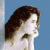 A woman with brown hair in profile view against a blue background, with white text appearing sequentially on the right side.