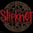 Circular brown cookie with dark spots overlaid by red stylized text reading 'slipknot' on a black background.