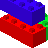 Pixelated 3D block structure with red, blue, and green sections on gray background