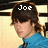 Pixelated image of a person with brown hair in blue clothing, showing two text states above the head.