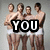Four shirtless men in white briefs stand in a group, with text overlays changing across frames to form 'YOU WANT THIS' while one man shifts his pose.