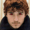 A two-part animated icon shows a man with curly brown hair and red eyes in the top section, transitioning to his face with metallic claws extended below.