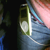 Animated sequence showing a green iPod with white earbuds in various contexts including a pocket, hand, and stylized graphic with 'my' text.