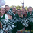 Pixelated image of a group of people outdoors with green text on blue background reading 'i love my friends (333)'.