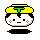 Pixelated cartoon head with yellow hair, green T-shaped accessory, white face, black eyes and mouth, orange cheek marks, black base on gray background.