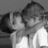 Black-and-white pixelated image of two people kissing on the left, with 'I Love You' text and heart symbols on a black background to the right.