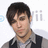 A pixelated image of a person with dark hair wearing a gray shirt and black vest, next to text reading 'PeTe weNtZ' on a black background.