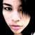 A pixelated image of a person with dark hair and light skin, showing three distinct facial expressions across a