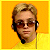 Pixelated image of a person with light brown hair wearing sunglasses and a yellow shirt against an orange background, next to purple text reading "I'm Hooked on Jessel!".