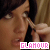 A contact sheet of 10 animated frames showing a woman applying makeup with an eyeliner brush, each frame featuring the word "GLAMOUR" in pink pixelated text at the bottom.