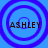 Four identical blue circular patterns with purple rings surround the text ASHLEY in brown pixelated letters on a solid light blue background.