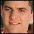 Pixelated close-up of a person's face showing eyes, nose, mouth, and partial hair, with visible pixelation and color blending.