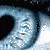 Pixelated close-up of a human eye with heart-shaped pupil, showing multiple views including one with visible eyelashes and another with darkened upper lid.