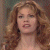 A 50x50 pixel buddy icon split into two sections: a left-side portrait of a woman with long curly red hair and right-side green text on dark background reading "Original Icons .com".