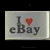 Two side-by-side animated frames of a pixelated 'I ❤️ eBay' icon with heart color change from red to pink.