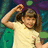 Pixelated image of a person in a light-colored shirt with one arm raised, next to green text reading "it's bindi bish! :)" on dark background.