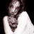 Pixelated grayscale image of a person with long hair wearing a sleeveless top against black background, likely a celebrity or character icon from early internet era.