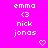 Pixelated text and symbols on a bright pink background with two heart icons below the names.