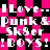 Pixelated static icon with bold white text on a pink and black checkered background, displaying the phrase "I Love Punk Skater Dolls!" in four lines of blocky lettering.
