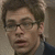 A four- shows a person with short brown hair and glasses in sequential poses against a light background