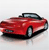 Red convertible car with black roof and silver wheels, angled slightly left on light gray background.
