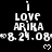 Black background with white pixelated text reading "I LOVE ARIKA" and date "8.24.08", repeated in a pattern with small heart symbols below each instance