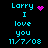 Pixelated cyan text on black background reads 'Larry I love you 11/7/08' with a pink heart or starburst symbol changing between frames.