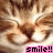 A pixelated image of a person's face with light brown hair and closed eyes, overlaid by a pink banner containing the text 'smile!!' in black block letters.