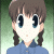 Pixelated anime-style character with brown pigtails and blue eyes, wearing a blue collared shirt against green and pink backgrounds.