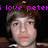 Pixelated image of a person with brown hair and light skin, overlaid with purple text reading 'i love peter' on black background.